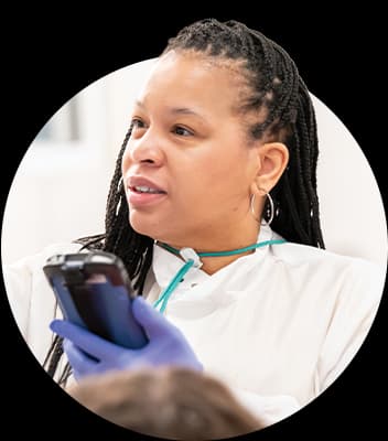 BioLife healthcare professional checking a machine.